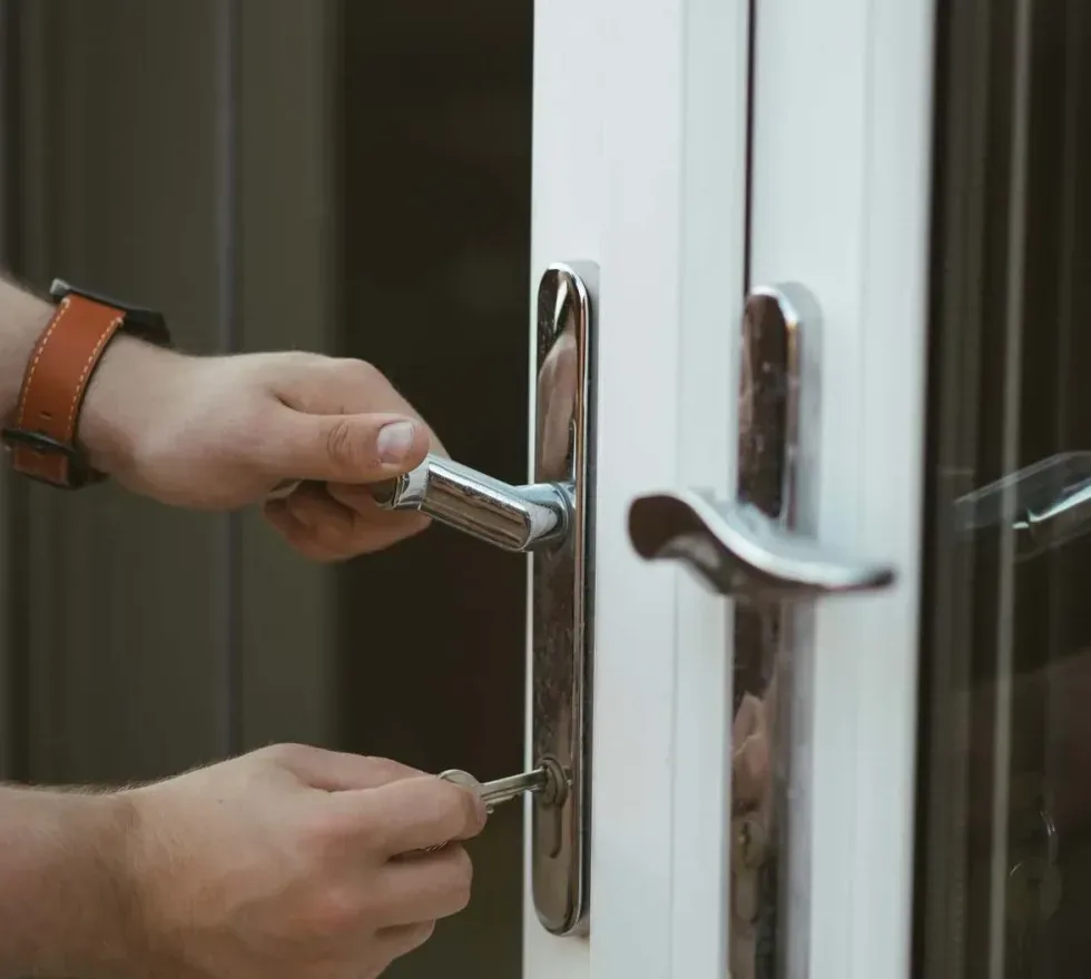 Locksmith tool positioned at the seam of a car door during a non-destructive vehicle entry