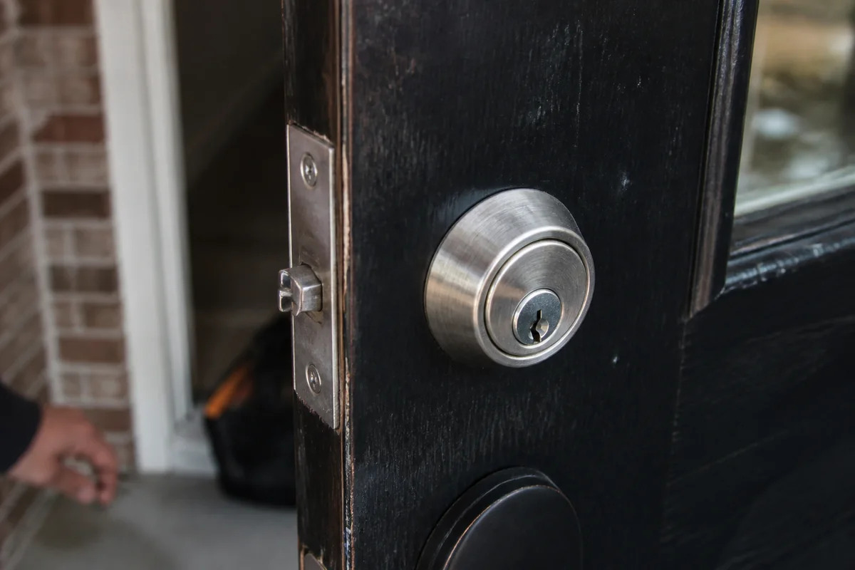 Commercial door latch and frame hardware in a clean business-entry detail