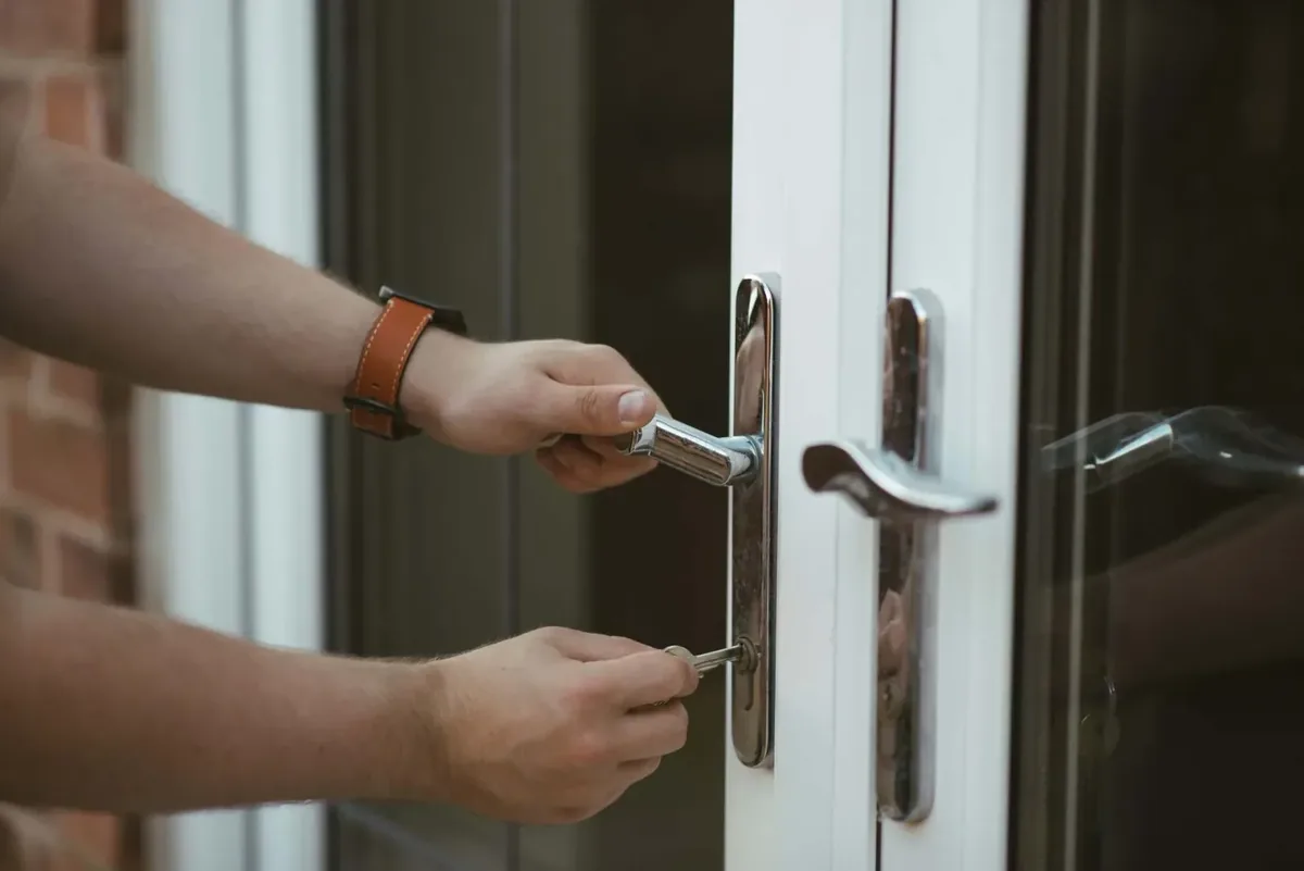 Close detail of a residential deadbolt during a controlled home-entry assessment