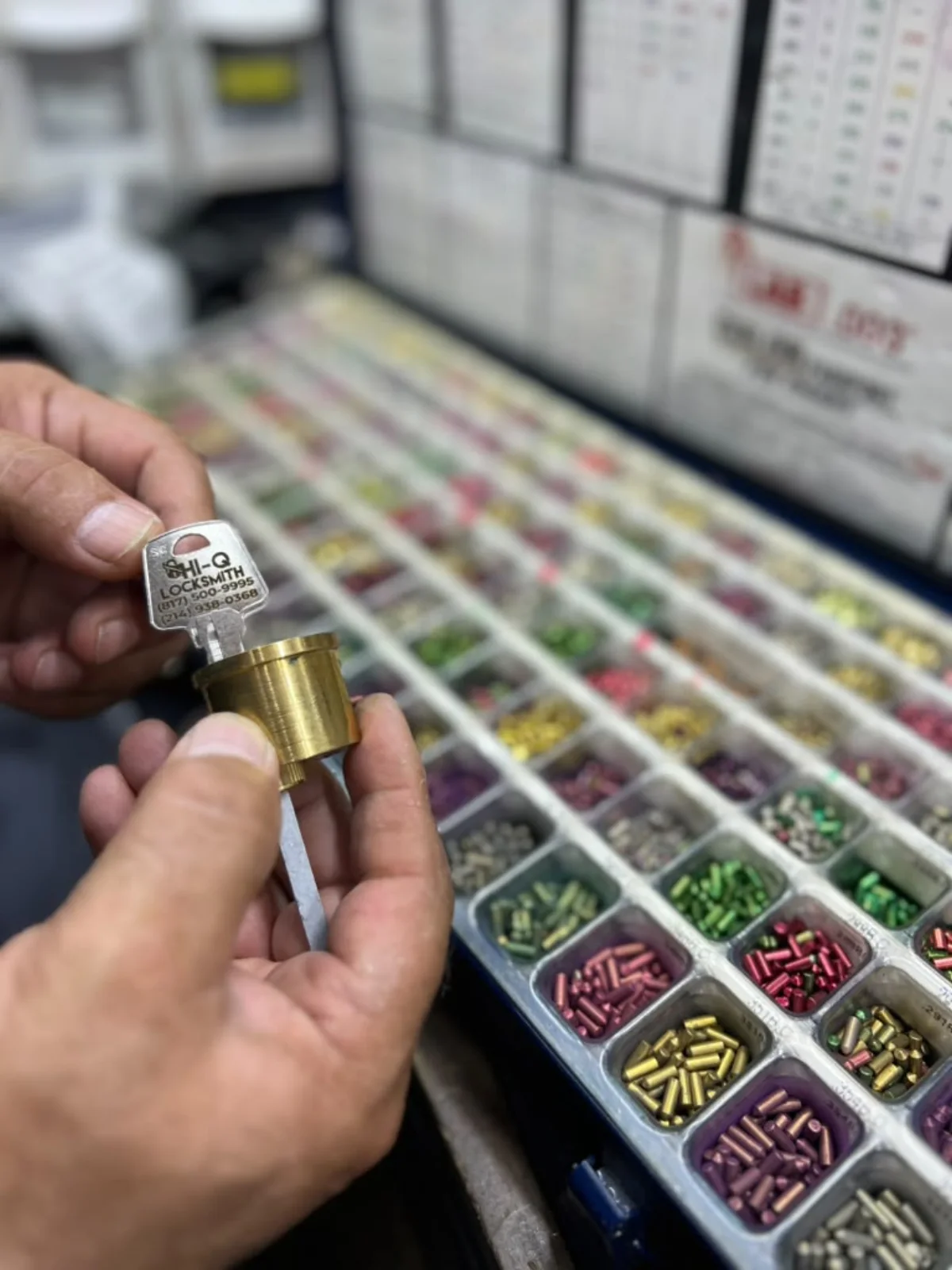 Hi-Q Locksmith branded key and residential lock cylinder during a Fort Worth rekeying service